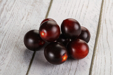 Raw ripe black kumato tomato