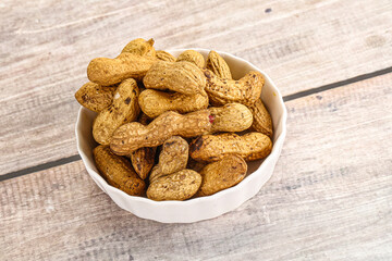 Raw ripe unpeeled peanut heap