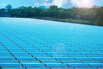 Photovoltaic modules reflect sunlight and clouds, Solar panels (solar cell) lined up in pond, Power...
