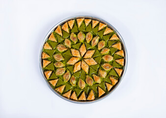 Top view of baklava varieties in a tray isolated on white background.