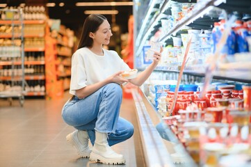 Groceries Shopping. Portrait Of Smiling Happy Woman Leaning On Trolley Cart In Supermarket