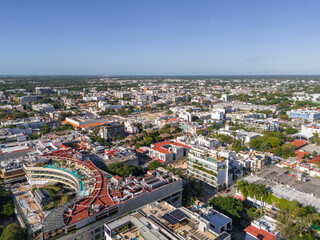 Aerial drone view of Playa del Carmen downtown area with rooftop swimming pools and cloudless blue...