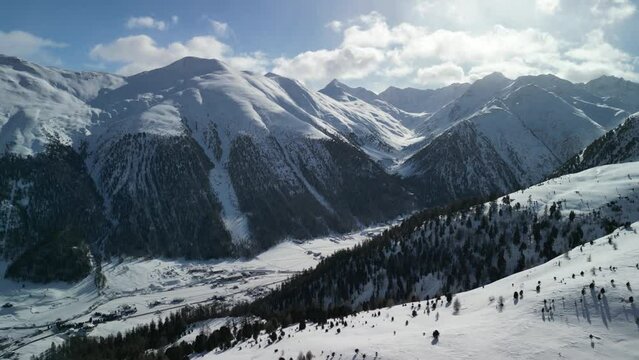 Sunny day over snow-covered Apls