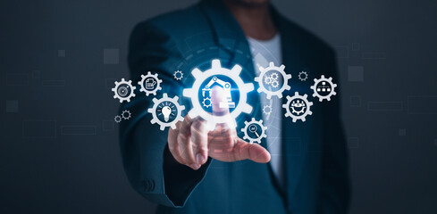 concept of automatic control system with modern technology Innovation for business process management.businessman touches a gear icon showing the operation of robotic automation software