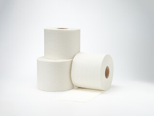 Rolls of toilet paper on white background.