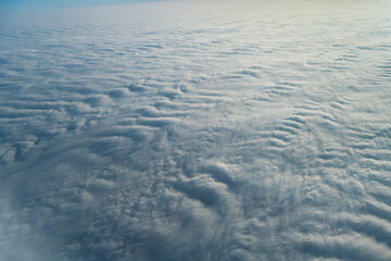 Aerial view on white fluffy clouds