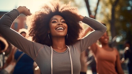 Close up of happy young woman training at park. Group of happy african american women exercising together outdoors. Healthy lifestyle concept. - obrazy, fototapety, plakaty