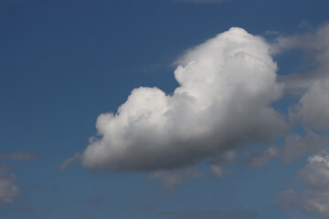 White clouds in the blue sky.