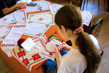 Embroidery is the main women's hobby in the village. Background with selective focus and copy space