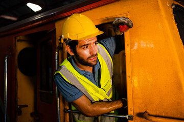 Professional railway engineer. train driver uses a walkie-talkie or walkie-talkie in the interior room to control the train.