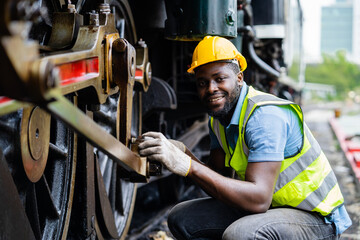 Railway workers working with industrial machinery.