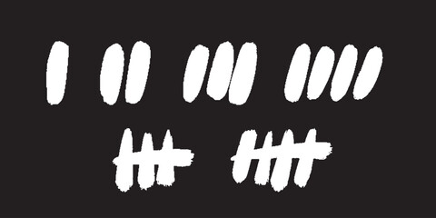 Set of tally marks. Vector hand drawn icons. White colored slash strokes on black board