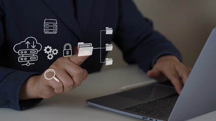 Businessman hand using laptop computer with data host server storage icon for information exchange...