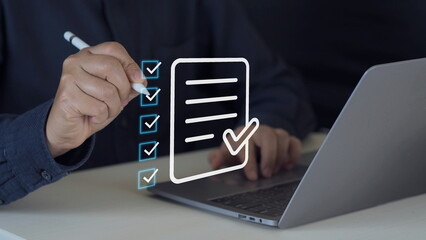 Business performance checklist, businessman using laptop doing online checklist survey, filling out digital form checklist, take an assessment, questionnaire, evaluation, online survey, online exam.