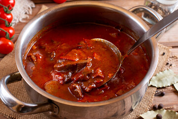 Goulash or Gulasch is a soup or stew of meat and vegetables seasoned with paprika and other spices. Perfect for recipe, article, menu book, or any cooking contents.