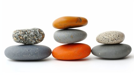 Pebbles balancing on white background. Sea pebble. Balancing pebbles. For banner, wallpaper, meditation, yoga, spa, the concept of harmony, balance. Smooth river stones