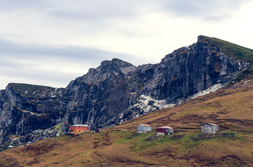 Plateau houses and black rocks
