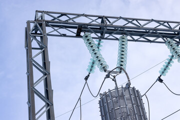 Insulators of power line poles and transformer in close-up