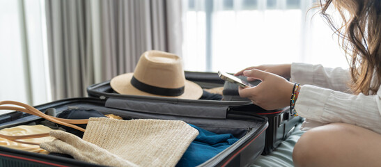 Woman packing suitcase on bed for a new journey packing list for travel planning preparing vacation Book Now Traveling Transportation