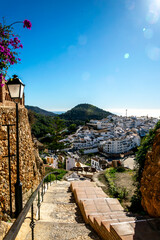 Beautiful view of the white city of Frigiliana, Andalusia, Spain, mountains and sea in the distance.
