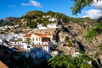 White houses on the slopes of the mountains. Panoramic view of the village of Frigiliana, Andalusia, Spain.
