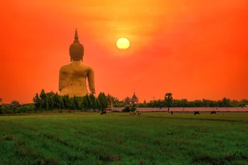 Keuken foto achterwand Big Statue buddha image at sunset in southen of Thailand © nuttawutnuy