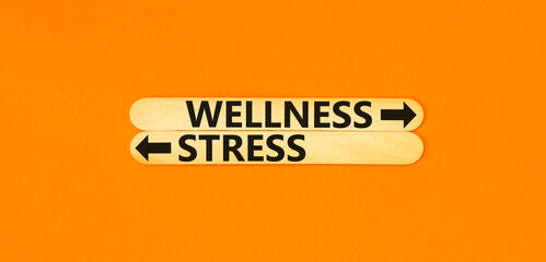 Wellness or stress symbol. Concept word Wellness or Stress on beautiful wooden stick. Beautiful...