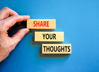 Share your thoughts symbol. Concept words Share your thoughts on beautiful wooden blocks. Beautiful blue table blue background. Businessman hand. Business share your thoughts concept. Copy space.