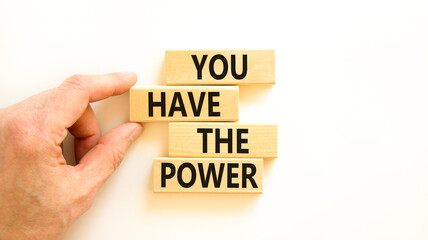 You have the power symbol. Concept word You have the power on beautiful wooden block. Beautiful white background. Businessman hand. Business motivational you have the power concept. Copy space.