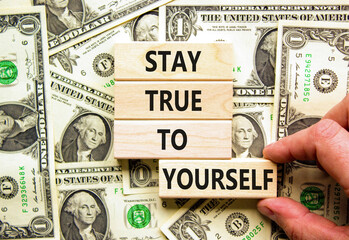 Stay true to yourself symbol. Concept word Stay true to yourself on beautiful wooden block. Dollar...