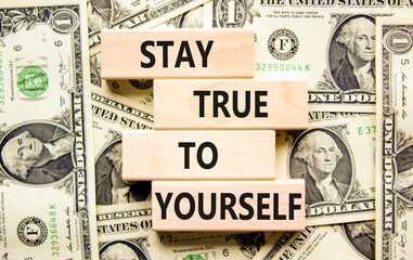 Stay true to yourself symbol. Concept word Stay true to yourself on beautiful wooden block. Dollar...