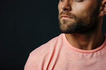Fototapeta premium A man in a trendy peach T-shirt. Close up collar.