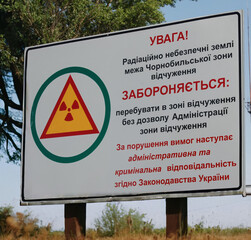 Signs placed at the beginning of the exclusion zone in the city of Pripyat (Ukraine), famous for...