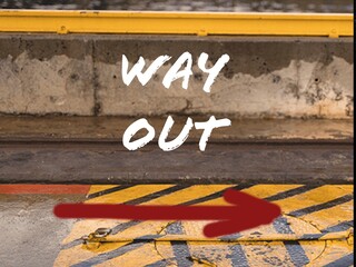 Way out written on asphalt. Sign on the road. - 724933046