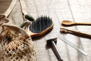 Crochet bag, wooden hairbursh, face roller, reusable razor, glass nail file, wooden toothbrush and...