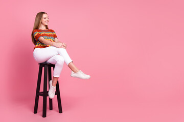 Full length photo of lovely positive person sit comfy stool look empty space fantasize isolated on...