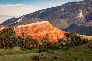 Red sandstone chugwater rock formation at sunset in northwest Wyoming, USA.