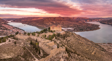 Mequinenza castle panoramic aerial view above the riba roja reservoir in Aragon Spain with dramatic...