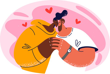 Happy interracial couple kissing enjoying romantic relationships. Smiling multiethnic man and woman hug show affection and love.