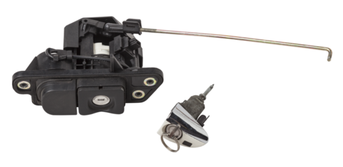 Detail of a car spare part made of black plastic and metal - keyhole lock with key for opening the trunk separately, isolated on a white background. Repair in a car workshop, equipment for sale.