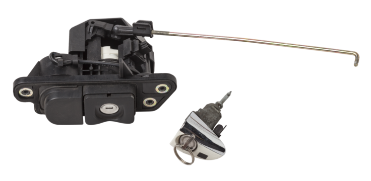 Detail of a car spare part made of black plastic and metal - keyhole lock with key for opening the trunk separately, isolated on a white background. Repair in a car workshop, equipment for sale.