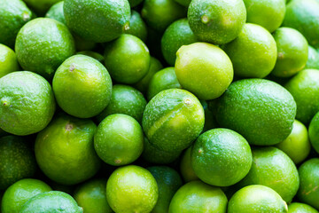 Lemon lime stack in traditional market, close-up