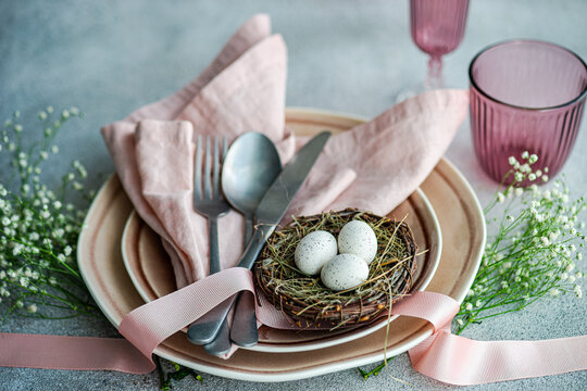 Easter table setting with pastel accents and eggs