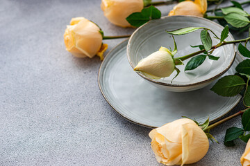 Elegant Table Setting with Peach Roses and Greenery