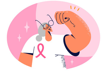 Smiling elderly woman with pink ribbon on chest overcome cancer. Happy mature grandmother survive oncology. Healthcare.