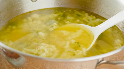 Pot of cauliflower broccoli soup close-up. Delicious homemade vegetarian soup