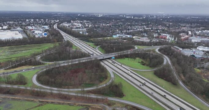 Birds eye aerial drone view of an intersection at the german autobahn,Bremen, Germany. Transportation and mobility. Unlimited speed limit. Driving over the highway.