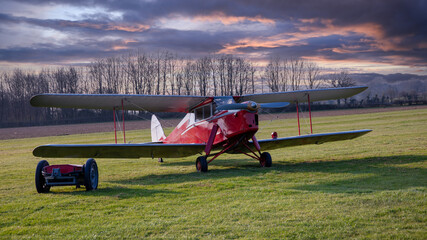 Vintage passenger airplane on the ground. Biplane