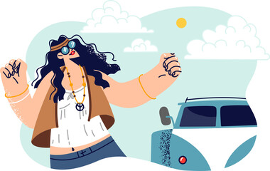 Hippie woman dances standing near minivan and celebrates start of trip or summer vacation