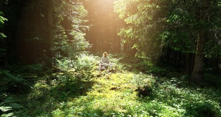 Young African Woman Practicing Yoga Meditation Exercise In Forest Nature 